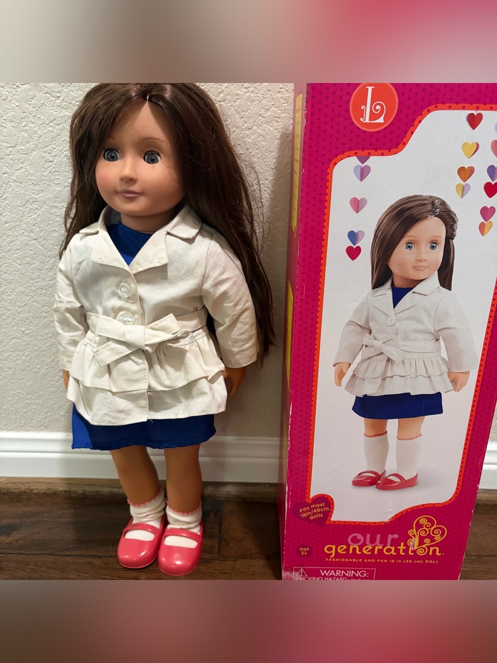 Our Generation Doll Wearing White Trench Coat and Blue Dress
